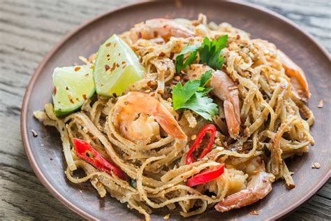 Thai foo - Jun 18, 2018 · Once water is boil, add drained noodles and cook for 2 minutes. Remove from heat and drain promptly to prevent noodles from getting mushy. In a small bowl, mix together all “sauce” ingredients. Pour sauce onto drained noodles and mix well. Add shredded cabbage, shredded carrots and shredded cilantro to noodle mixture. 